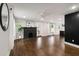 Spacious living room with a fireplace, hardwood floors and ample natural light creating an inviting atmosphere at 345 Adelle Se St, Atlanta, GA 30315