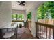 Charming outdoor patio with brick arches, a ceiling fan, and a view of the neighborhood at 345 Adelle Se St, Atlanta, GA 30315