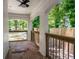 Covered patio with brick floors, white painted brick arches, and a backyard view at 345 Adelle Se St, Atlanta, GA 30315