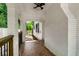 Brick-paved covered patio with painted white brick walls and ceiling fan at 345 Adelle Se St, Atlanta, GA 30315