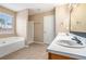 Bright bathroom with a soaking tub, separate shower, and double sink vanity at 555 Sydney Crest Ln, Lawrenceville, GA 30046