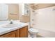 Clean bathroom featuring a shower-tub combo, vanity sink, and tile flooring at 555 Sydney Crest Ln, Lawrenceville, GA 30046