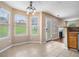 Bright breakfast nook featuring tile flooring, backyard views, and access to an outdoor patio at 555 Sydney Crest Ln, Lawrenceville, GA 30046
