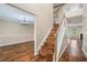 Inviting entryway with hardwood floors, chandelier lighting, and an open staircase that creates an airy atmosphere at 555 Sydney Crest Ln, Lawrenceville, GA 30046