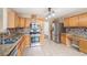 Spacious kitchen with stainless appliances, mosaic backsplash, and a convenient built-in desk area at 555 Sydney Crest Ln, Lawrenceville, GA 30046