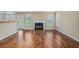 Inviting living room with a fireplace, hardwood floors, and a view to the kitchen, perfect for entertaining at 555 Sydney Crest Ln, Lawrenceville, GA 30046