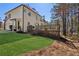Well-manicured lawn leads up to this two-story home and large, wooden deck with ample space at 7115 Doncaster Ct, Cumming, GA 30040