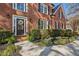 Charming front entrance with manicured landscaping and a decorative wreath on the dark wood door at 7115 Doncaster Ct, Cumming, GA 30040