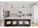 Elegant kitchen with stainless steel appliances, white cabinets, and an island with seating at 1836 Memorial Dr # 303, Atlanta, GA 30317