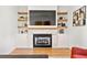 Cozy living room featuring a fireplace, floating shelves, and stylish decor at 1836 Memorial Dr # 303, Atlanta, GA 30317