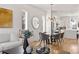 Open-concept living space features modern lighting and dining area at 1836 Memorial Dr # 303, Atlanta, GA 30317