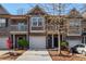 Charming townhouse with brick and siding, featuring an attached garage and a well-maintained front yard at 2359 Castle Keep Way, Atlanta, GA 30316