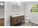 Bathroom featuring granite countertop vanity and modern fixtures at 2487 Highland Se Dr, Conyers, GA 30013