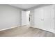 An empty bedroom with wood-look floors and a closet at 2487 Highland Se Dr, Conyers, GA 30013