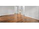 Spacious bedroom with hardwood floors and neutral paint throughout at 2487 Highland Se Dr, Conyers, GA 30013