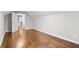 Cozy bedroom featuring hardwood floors, neutral walls, and an open doorway to another room at 2487 Highland Se Dr, Conyers, GA 30013