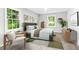 Tastefully decorated bedroom with neutral tones and natural light from large windows at 2487 Highland Se Dr, Conyers, GA 30013