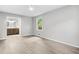 A bedroom with gray walls and hardwood floors next to a bathroom at 2487 Highland Se Dr, Conyers, GA 30013