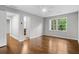Spacious bedroom with hardwood floors, multiple doors, and a ceiling fan at 2487 Highland Se Dr, Conyers, GA 30013