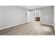 Spacious room featuring light gray walls and modern floors next to a bathroom at 2487 Highland Se Dr, Conyers, GA 30013
