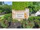 Stone monument sign for Fieldstone Estates surrounded by manicured landscaping and colorful flower beds at 2487 Highland Se Dr, Conyers, GA 30013