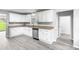 Bright kitchen featuring white cabinets and stainless steel appliances at 2487 Highland Se Dr, Conyers, GA 30013