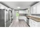 Modern kitchen with stainless steel appliances and granite countertops at 2487 Highland Se Dr, Conyers, GA 30013