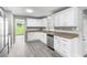 Bright kitchen with stainless appliances, granite counters, and backyard view at 2487 Highland Se Dr, Conyers, GA 30013
