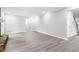 Spacious living room with modern flooring, neutral walls, and a stone fireplace at 2487 Highland Se Dr, Conyers, GA 30013