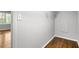 Walk-in closet offers open wire shelving and natural light from an adjacent room at 2487 Highland Se Dr, Conyers, GA 30013