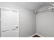 Spacious walk-in closet with white wire shelving for optimal storage at 2487 Highland Se Dr, Conyers, GA 30013