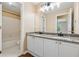 Bathroom with double sink vanity, granite countertop, and tub shower at 3355 Golfe Links Dr, Snellville, GA 30039