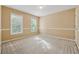 This neutral bedroom has bright natural light from two windows at 3355 Golfe Links Dr, Snellville, GA 30039