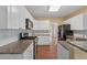 Bright kitchen with white cabinets, tile backsplash, stainless steel appliances, and granite counters at 3355 Golfe Links Dr, Snellville, GA 30039