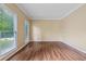 Spacious, bright living room with hardwood floors and large windows at 3355 Golfe Links Dr, Snellville, GA 30039