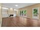 Spacious living room featuring hardwood floors, fireplace, and built-in shelving at 3355 Golfe Links Dr, Snellville, GA 30039