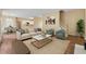 Bright, furnished living room with view of the kitchen and staircase at 3355 Golfe Links Dr, Snellville, GA 30039