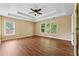 Spacious main bedroom with tray ceiling and natural light from large windows at 3355 Golfe Links Dr, Snellville, GA 30039