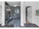 A modern bathroom features a glass shower enclosure with marble tile and a built-in bench at 3562 Clubland Dr, Marietta, GA 30068