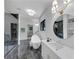 A modern bathroom featuring a glass shower, a soaking tub, marble flooring, and white vanity at 3562 Clubland Dr, Marietta, GA 30068