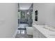 The bathroom features a glass shower, marble floors, and a modern vanity at 3562 Clubland Dr, Marietta, GA 30068