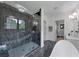 Spacious bathroom with marble floors, glass shower, a soaking tub, and a white vanity at 3562 Clubland Dr, Marietta, GA 30068