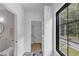 Well-lit bathroom connects to closet, featuring marble tile floors and a modern vanity at 3562 Clubland Dr, Marietta, GA 30068
