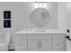 Modern bathroom vanity with white cabinetry, gold hardware, and stylish lighting fixtures at 3562 Clubland Dr, Marietta, GA 30068
