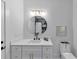 Modern bathroom with vanity, decorative mirror, and stylish fixtures at 3562 Clubland Dr, Marietta, GA 30068
