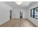 This bedroom with wood floors provides access to the bathroom and a scenic window view at 3562 Clubland Dr, Marietta, GA 30068