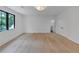 A large bedroom with wood floors features a ceiling light and access to a closet at 3562 Clubland Dr, Marietta, GA 30068