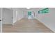 Large bonus room with hardwood floors, black railing, and views of outside greenery at 3562 Clubland Dr, Marietta, GA 30068