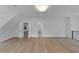 Bonus room featuring hardwood floors, modern lighting, and doorways to other rooms at 3562 Clubland Dr, Marietta, GA 30068
