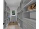 A walk-in closet features custom shelving, drawers, and ample storage space at 3562 Clubland Dr, Marietta, GA 30068